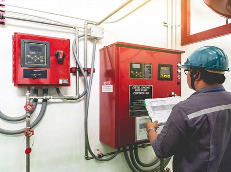 Professional expert installing fire alarm system