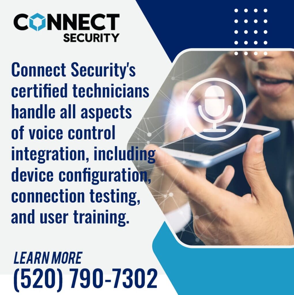 A certified technician holds a smartphone with a glowing microphone icon, demonstrating voice control integration for a security system.